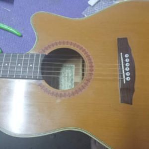 repaired acoustic guitar